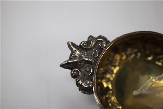 A George IV Scottish embossed silver quaich, 4.25in over handles.